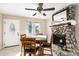 Bright dining area with stone fireplace and wood table at 632 N 95Th St, Mesa, AZ 85207