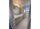 Clean bathroom with double vanity, marble countertop, and hexagon tile floor at 6449 E Dodge St, Mesa, AZ 85205