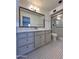 Updated bathroom featuring vanity, mirror, shower and mosaic tile floor at 6449 E Dodge St, Mesa, AZ 85205