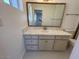 Bathroom boasts a large vanity with plenty of storage and hexagon tile floor at 6449 E Dodge St, Mesa, AZ 85205