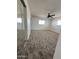 Bedroom with neutral carpet, windows and mirrored closet at 6449 E Dodge St, Mesa, AZ 85205