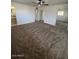 Bright and airy bedroom with mirrored closet doors and neutral carpeting at 6449 E Dodge St, Mesa, AZ 85205