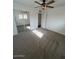 Well-lit bedroom with mirrored closet and neutral carpeting at 6449 E Dodge St, Mesa, AZ 85205