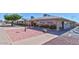 Community clubhouse with paved brick courtyard and seating at 6449 E Dodge St, Mesa, AZ 85205