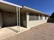 Exterior view of a home with desert landscaping and a covered patio area at 6449 E Dodge St, Mesa, AZ 85205