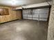 Spacious two-car garage with added cabinets and shelving at 6449 E Dodge St, Mesa, AZ 85205