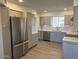 Modern kitchen with stainless steel appliances and gray cabinets at 6449 E Dodge St, Mesa, AZ 85205