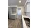 Elegant kitchen featuring white quartz countertops, stainless steel sink and gray cabinets at 6449 E Dodge St, Mesa, AZ 85205