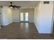 Open living space with hardwood floors and french doors at 6449 E Dodge St, Mesa, AZ 85205