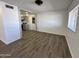 Bright and airy living area showcasing vinyl flooring and an open layout at 6449 E Dodge St, Mesa, AZ 85205