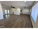 Spacious living room features new vinyl flooring, modern ceiling fan and lots of natural light at 6449 E Dodge St, Mesa, AZ 85205