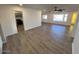 Bright living room featuring hardwood floors and a view into the kitchen at 6449 E Dodge St, Mesa, AZ 85205