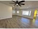 Spacious living room featuring vinyl floors, neutral paint and plenty of windows at 6449 E Dodge St, Mesa, AZ 85205