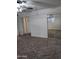 Main bedroom with mirrored closet doors and wall-to-wall carpet at 6449 E Dodge St, Mesa, AZ 85205