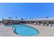 Inviting kidney-shaped swimming pool with lounge chairs at 6449 E Dodge St, Mesa, AZ 85205