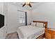 Bright bedroom with striped bedding and built-in shelving at 6565 E Thomas Rd # 1015, Scottsdale, AZ 85251