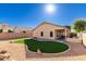 Artificial turf and gravel backyard with home view at 6612 W Paso Trl, Phoenix, AZ 85083