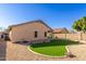 Artificial turf and gravel backyard with home view at 6612 W Paso Trl, Phoenix, AZ 85083