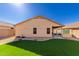 Artificial turf and gravel backyard with home view at 6612 W Paso Trl, Phoenix, AZ 85083