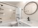 Clean bathroom with shower/tub combo, vanity, and storage at 6612 W Paso Trl, Phoenix, AZ 85083