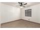 Bright bedroom with a window, ceiling fan and closet at 6612 W Paso Trl, Phoenix, AZ 85083