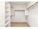 Walk-in closet with built-in shelves and hanging rods at 6612 W Paso Trl, Phoenix, AZ 85083