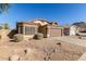 One-story house with brown garage door and desert landscaping at 6612 W Paso Trl, Phoenix, AZ 85083