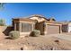 One-story house with brown garage door and desert landscaping at 6612 W Paso Trl, Phoenix, AZ 85083