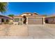 One-story house with brown garage door and desert landscaping at 6612 W Paso Trl, Phoenix, AZ 85083