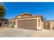 One story house with brown garage door, solar panels, and desert landscaping at 6612 W Paso Trl, Phoenix, AZ 85083