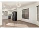 Kitchen features white cabinets, black appliances, and tile floors at 6612 W Paso Trl, Phoenix, AZ 85083