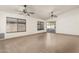 Spacious living room with tile floors and ceiling fans at 6612 W Paso Trl, Phoenix, AZ 85083