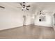 Spacious living room featuring tile floors and ceiling fan at 6612 W Paso Trl, Phoenix, AZ 85083