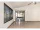 Living room with tile floors and sliding glass doors leading to backyard patio at 6612 W Paso Trl, Phoenix, AZ 85083