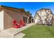 A serene backyard featuring a well-maintained lawn, patio, and a shed, offering a private outdoor space at 6811 N 11Th Ave, Phoenix, AZ 85013