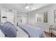 Bedroom featuring hardwood floors, a closet with built-ins, and natural light at 6811 N 11Th Ave, Phoenix, AZ 85013