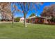 Quaint brick home boasting a well-maintained front yard and inviting porch at 6811 N 11Th Ave, Phoenix, AZ 85013