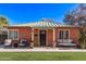 Charming brick home with a cozy front porch seating area and green lawn at 6811 N 11Th Ave, Phoenix, AZ 85013