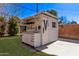 Exterior of a white shed with a lean-to roof, sink, attached counter space, and overhead storage at 6811 N 11Th Ave, Phoenix, AZ 85013