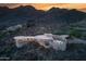 Aerial view of a home with a pool and desert landscape at 6836 N 36Th St, Phoenix, AZ 85018