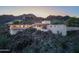 Stunning aerial view of a modern home with city lights in the background at 6836 N 36Th St, Phoenix, AZ 85018