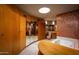 Bathroom with copper tile walls, a vanity with a marble top, and a large soaking tub at 6836 N 36Th St, Phoenix, AZ 85018