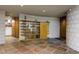 Entryway with a unique curved wood and glass shelving unit at 6836 N 36Th St, Phoenix, AZ 85018