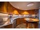 Curved kitchen with stainless steel appliances and wood cabinets at 6836 N 36Th St, Phoenix, AZ 85018