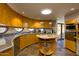 Unique curved kitchen with wooden island and stainless steel appliances at 6836 N 36Th St, Phoenix, AZ 85018