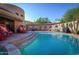 Inviting pool area with red chairs and a flagstone patio at 6836 N 36Th St, Phoenix, AZ 85018