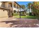 Spacious backyard features a basketball court, outdoor kitchen, mature trees, and luxury home exterior at 6876 S Star Dr, Gilbert, AZ 85298