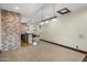 Finished basement featuring a bar with brick accents, neutral carpet, and recessed lighting at 6876 S Star Dr, Gilbert, AZ 85298