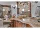 Vanity with granite countertop, vessel sink, and ornate mirror at 6876 S Star Dr, Gilbert, AZ 85298