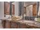 Bathroom with double sinks, marble countertop, and ornate mirror at 6876 S Star Dr, Gilbert, AZ 85298